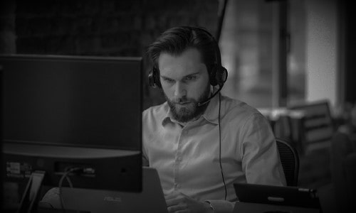 Security analyst working at desk